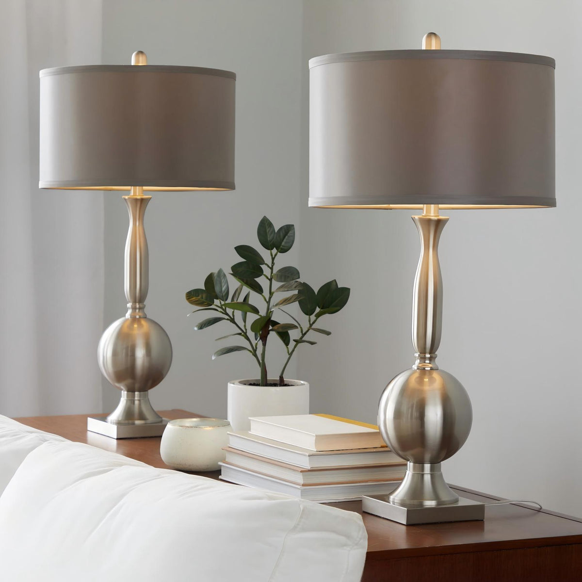 Set of 2 contemporary table lamps with gray drum shades and nickel bases on nightstand