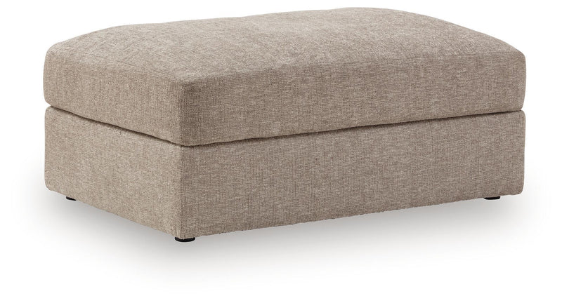 Oversized accent ottoman with light beige upholstered top and cushioned box base