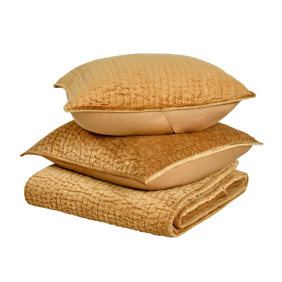 Tan velvet quilt set with matching pillows, folded and stacked for close-up view.