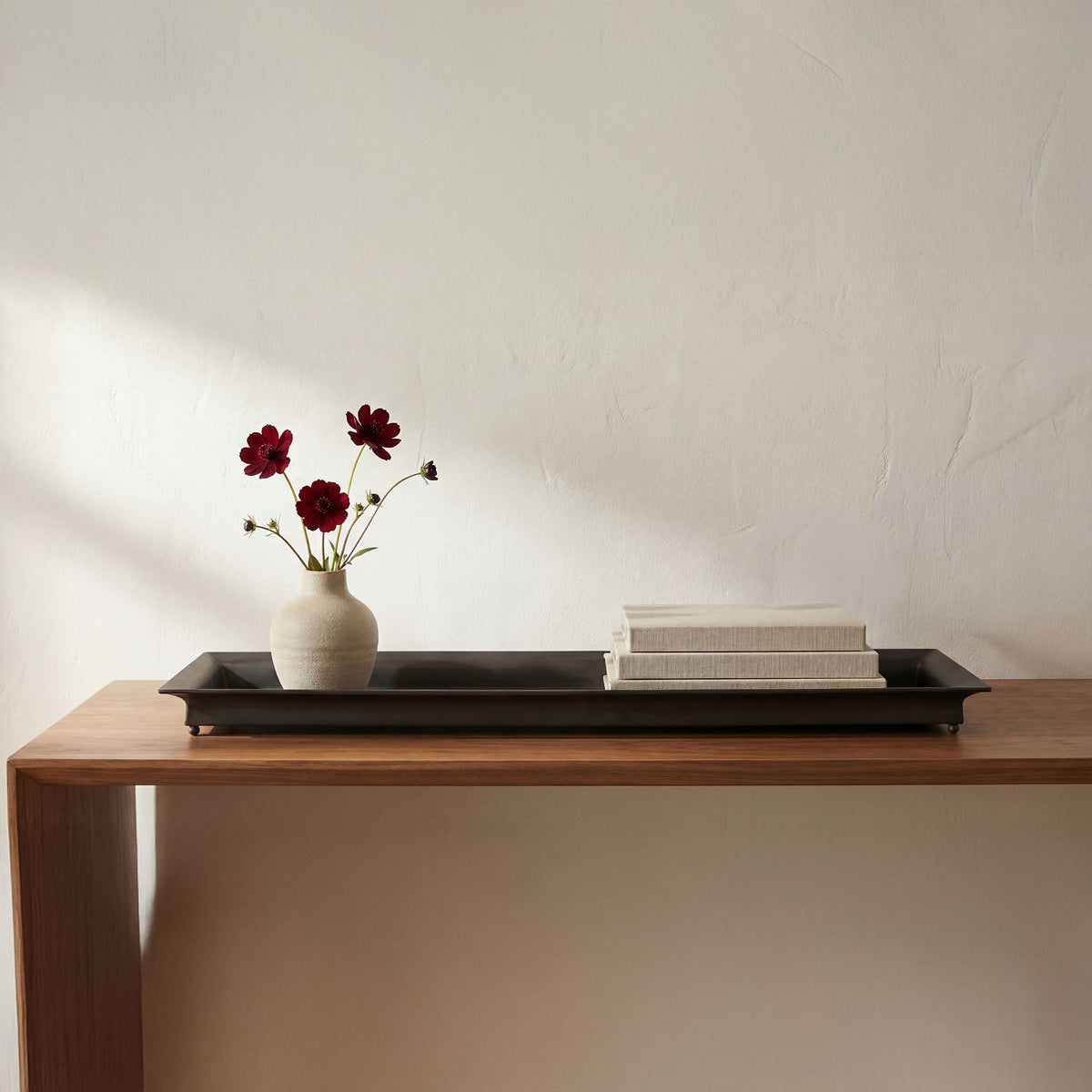 Dark-gray rectangular tray with raised edge, shown on a tabletop