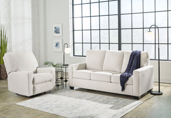 Beige fabric living room sofa with matching armchair, cushioned seats and rolled arms