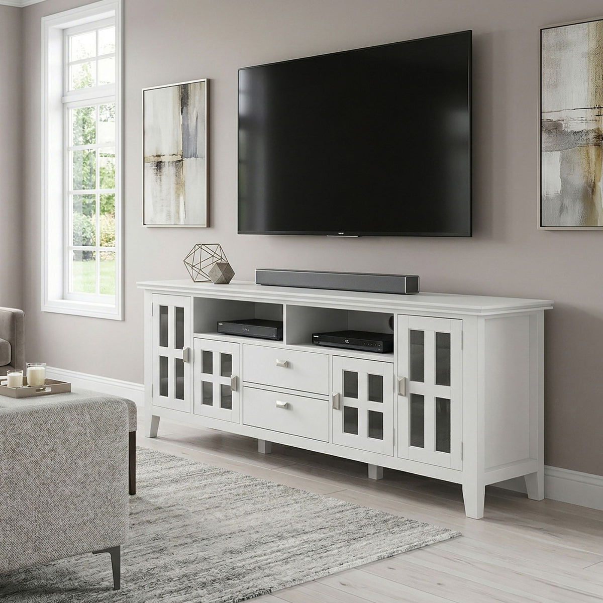 White TV media stand with center soundbar shelf and open storage behind glass doors