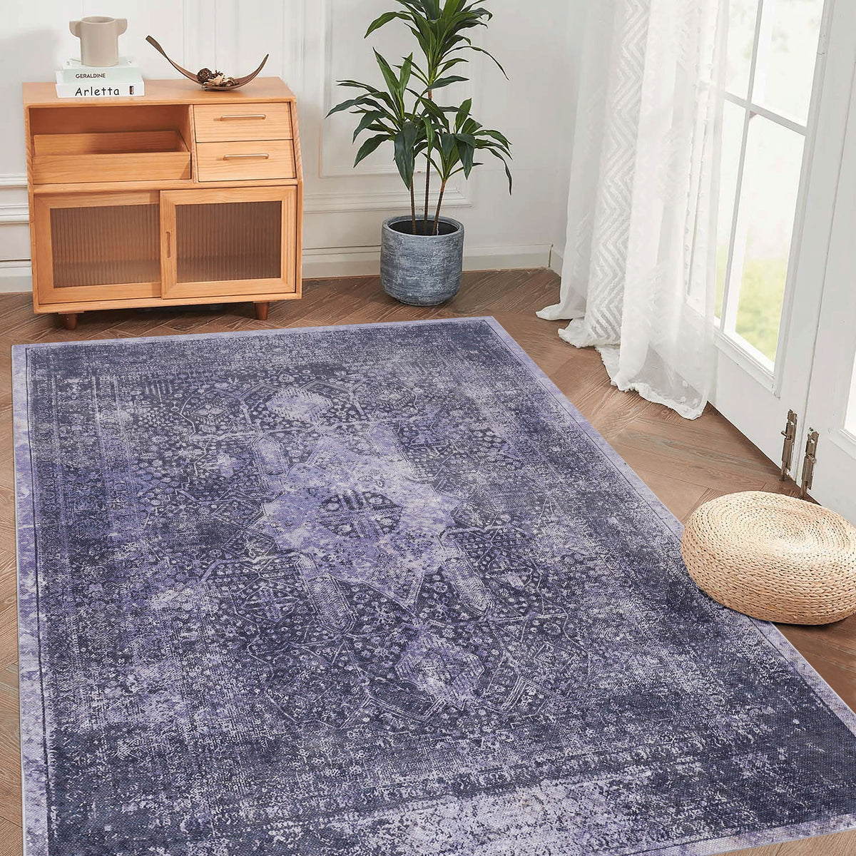 Blue washable area rug with distressed ornamental medallion pattern, rectangular.