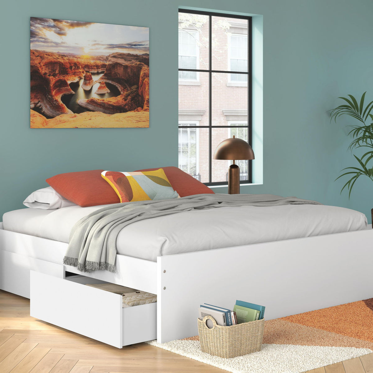 White platform bed with one side storage drawer under white bedding