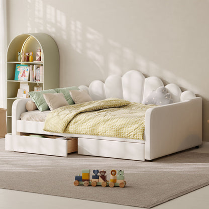 White upholstered daybed frame with scalloped shell headboard and storage drawers