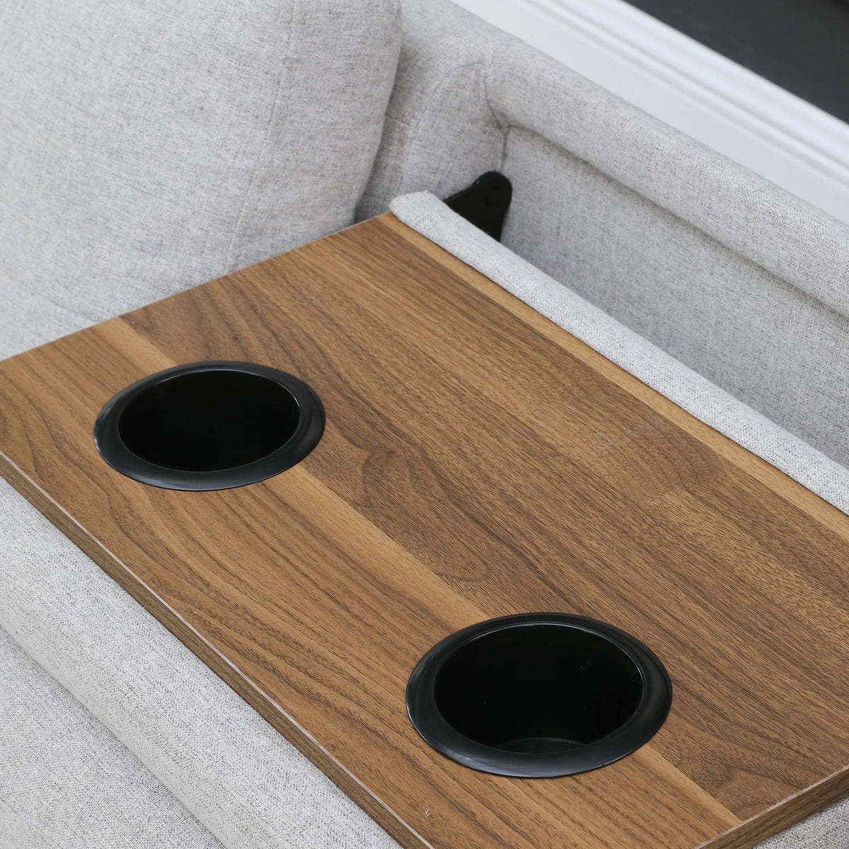 Wood serving tray with two cup holders on a gray ottoman