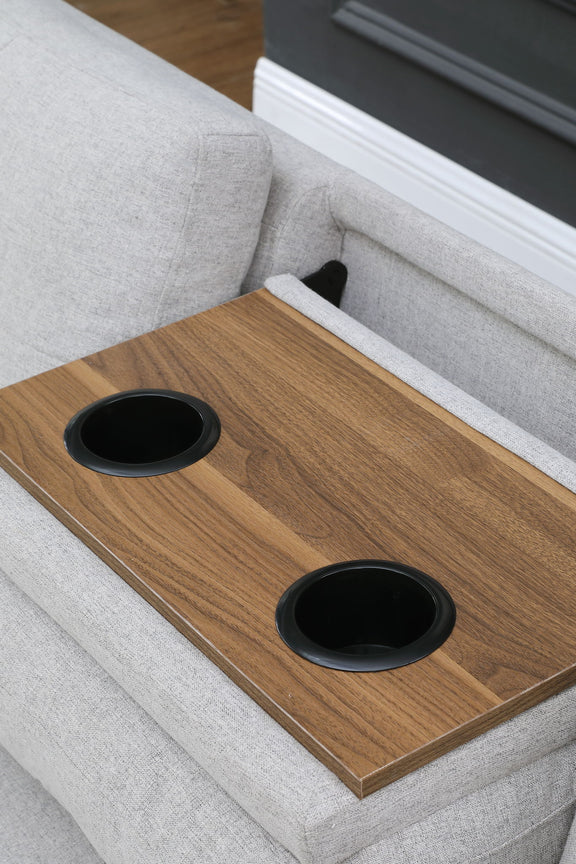 Wood serving tray with two cup holders on a gray ottoman