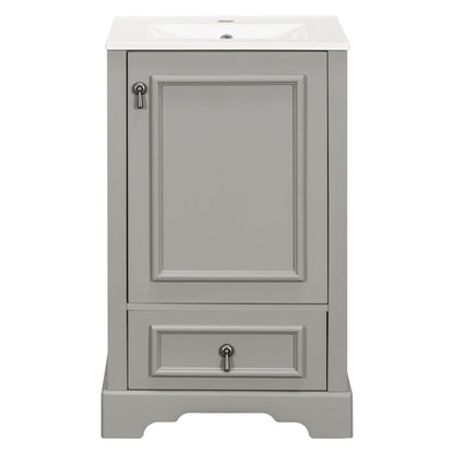 Gray bathroom vanity cabinet with white sink and paneled door