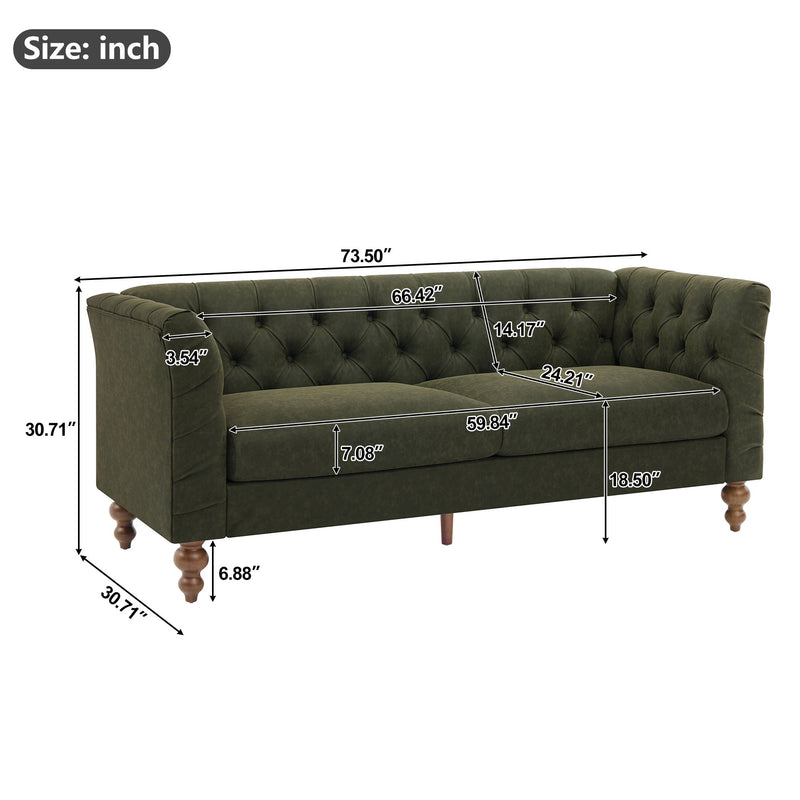 Dark green chesterfield-style sofa with tufted back, flared arms, and wooden legs