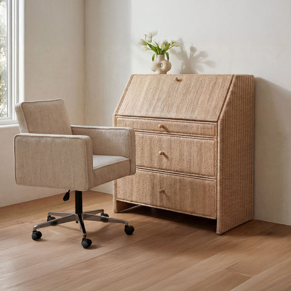 Natural rattan secretary desk with a drop-front writing surface and three drawers