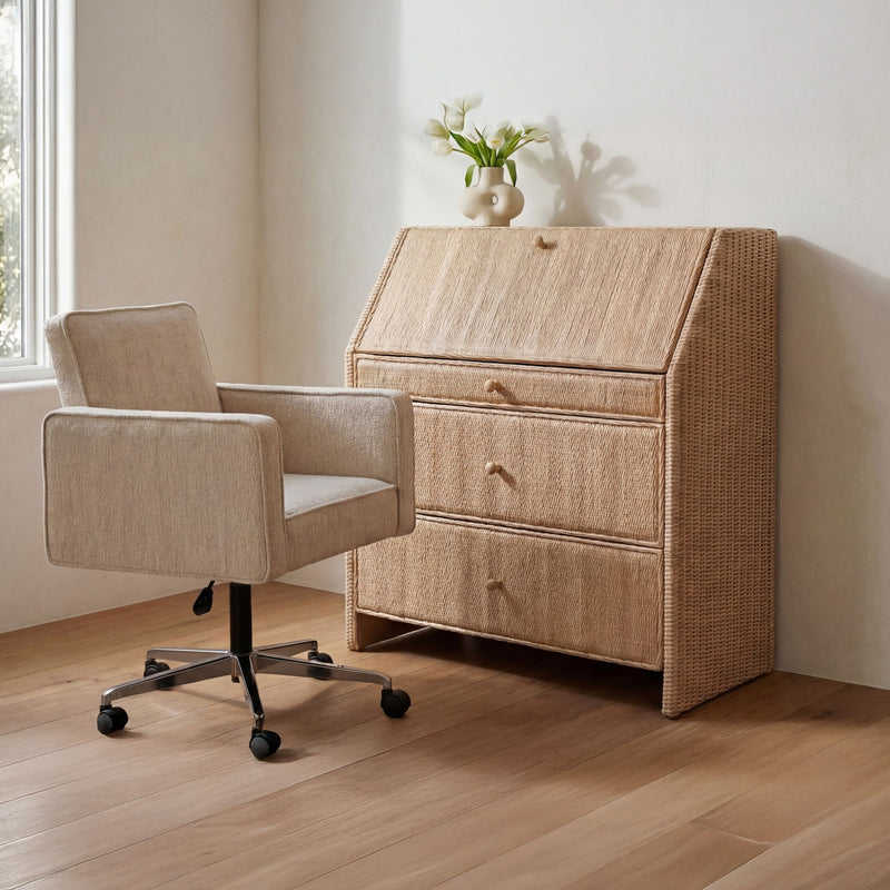 Natural rattan secretary desk with a drop-front writing surface and three drawers