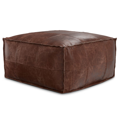 Handcrafted square pouf in dark brown leather with stitched panels and padded top