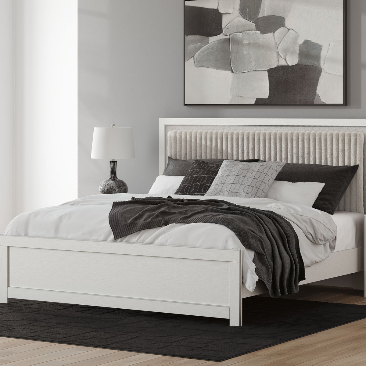 Upholstered platform bed with roll slats, white frame with dark upholstered headboard