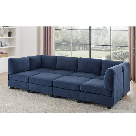 Blue modular sectional sofa with removable cushions, rounded arms, and ottoman bench seats