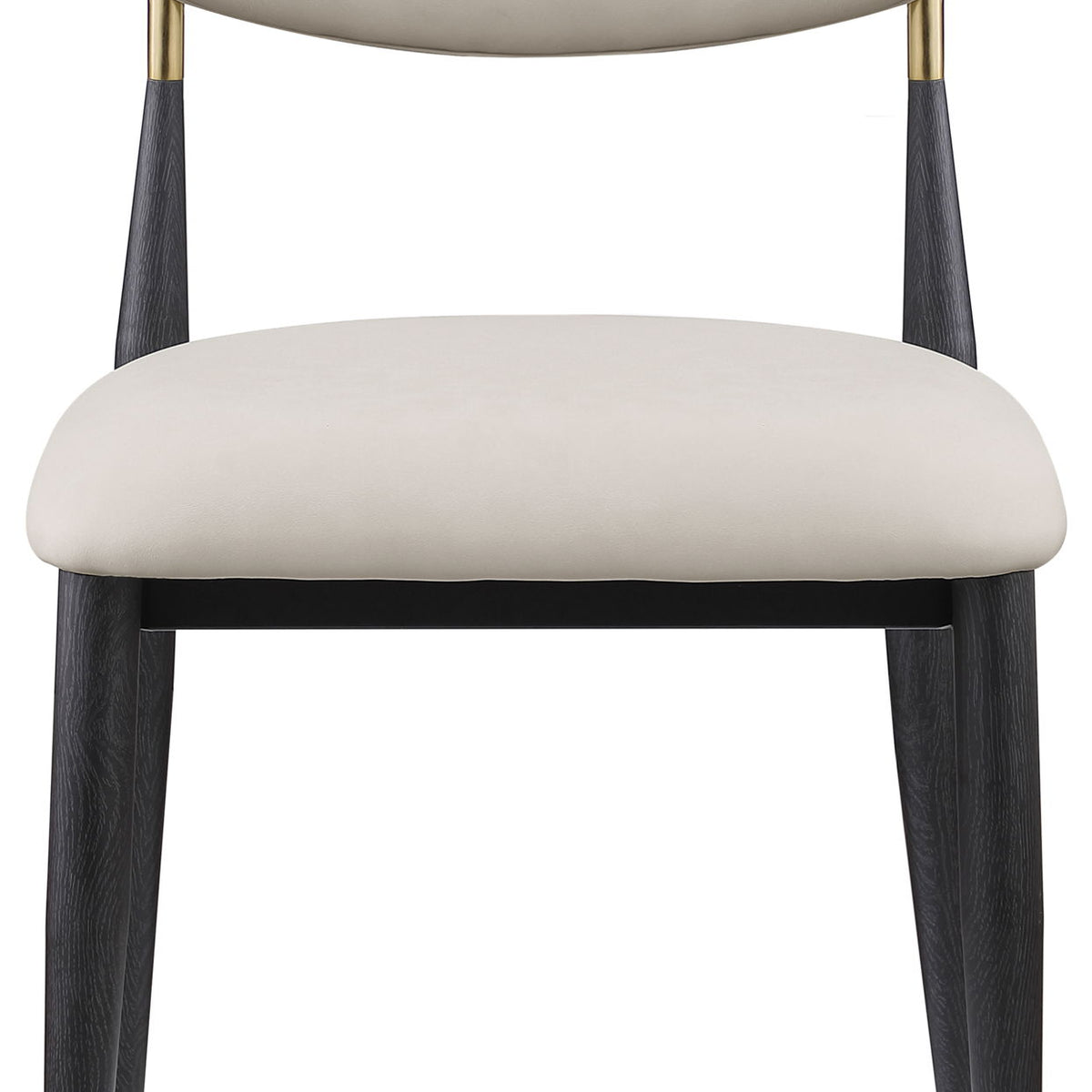 Cream vegan leather dining side chair with rounded back and seat, black legs with gold tips