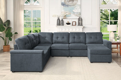 Dark gray fabric sectional sofa with tufted back cushions and matching ottoman