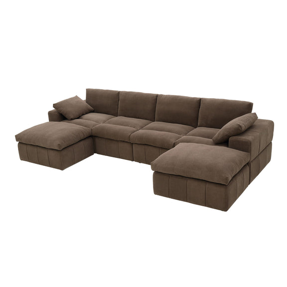 Dark brown sectional sofa with broad arms, chaise ends and toss pillows
