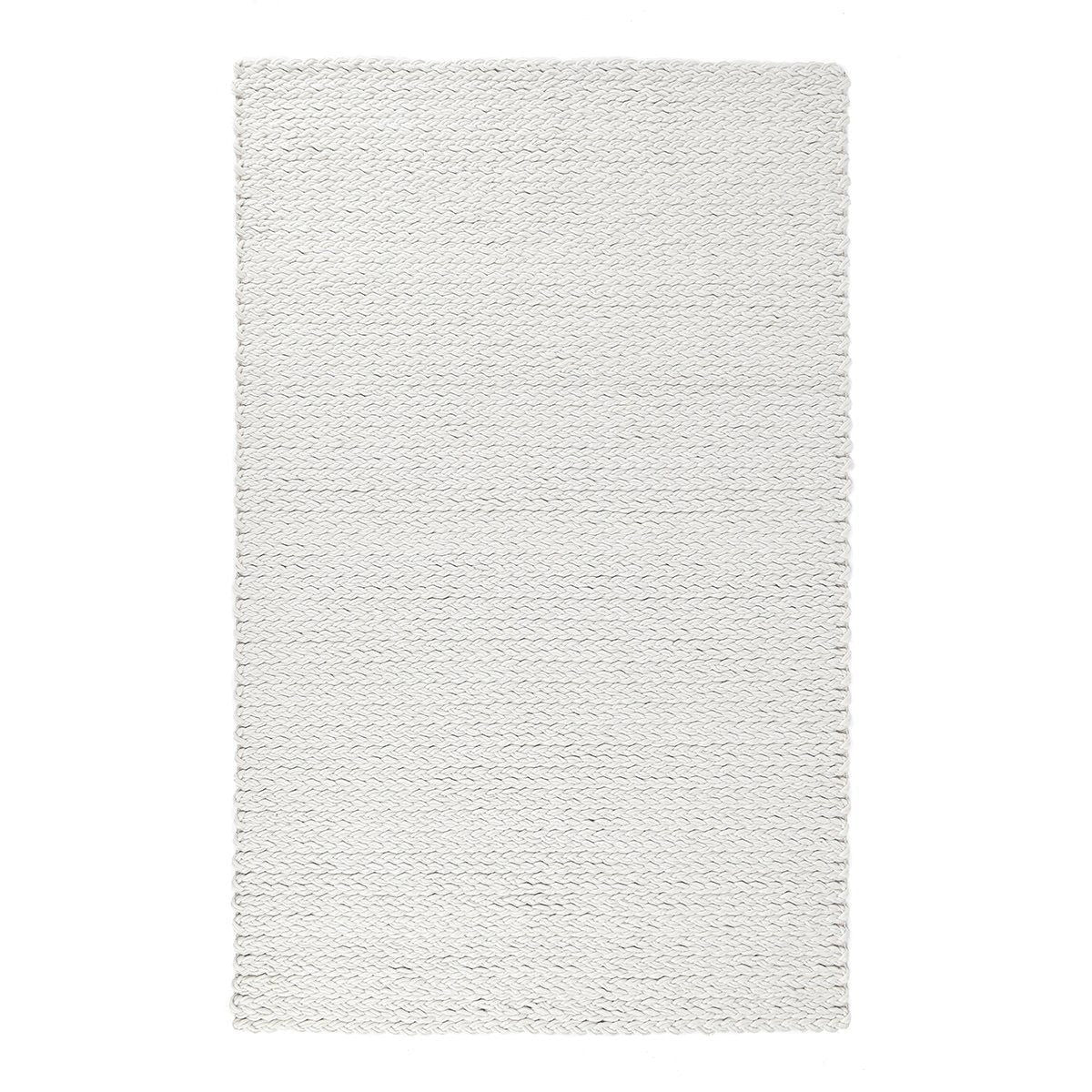 Ivory wool area rug with textured woven surface and short fringed border