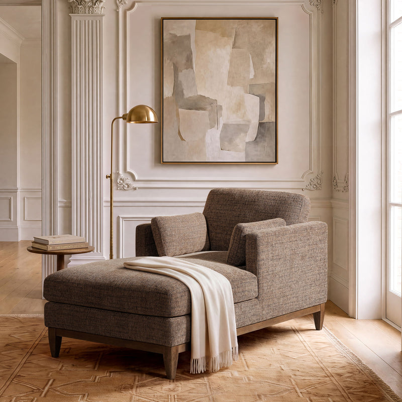 Brown and beige upholstered chaise lounge chair with padded arms and chaise cushion
