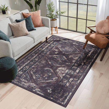 Dark blue washable rug with vintage distressed geometric and border design.