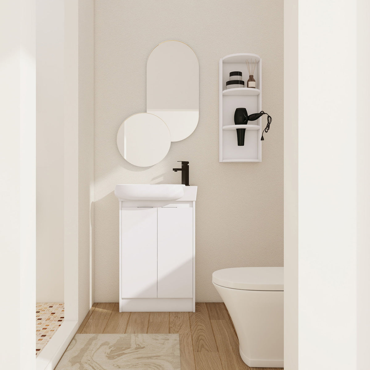 White freestanding bathroom vanity with oval sink and two cabinet doors, plus wall storage cabinet