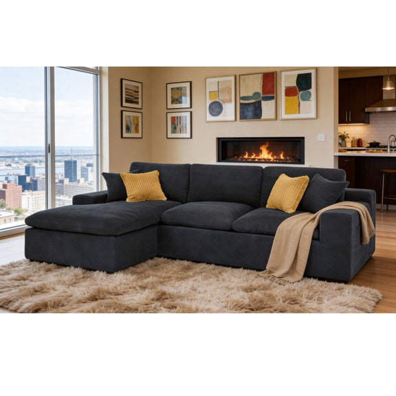 Dark gray U-shaped sectional sofa with chaise, throw blanket, and yellow accent pillows
