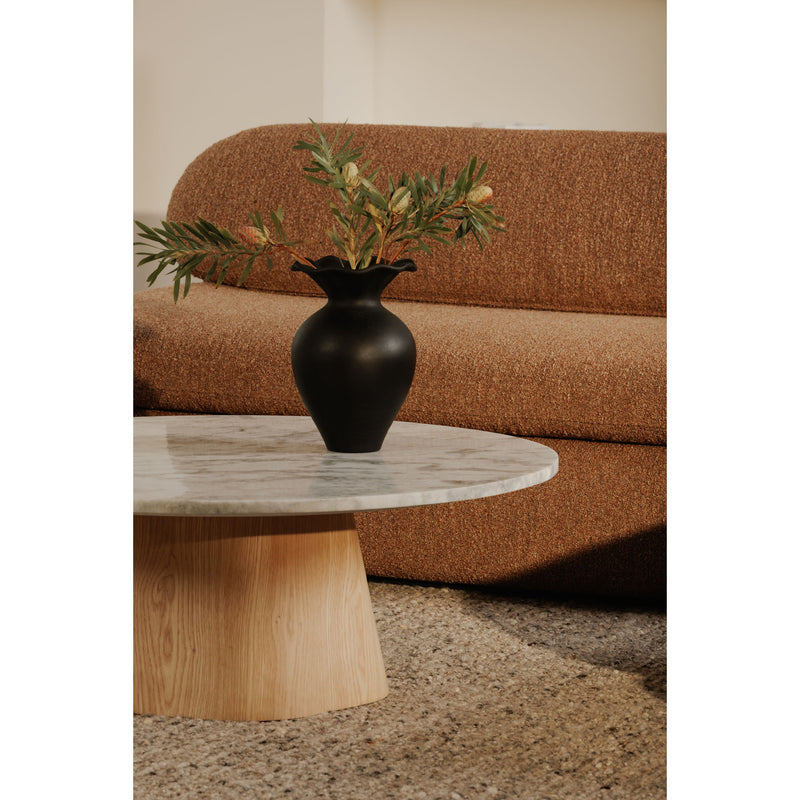 Round coffee table with ash grey stone-look top and tapered wood pedestal base