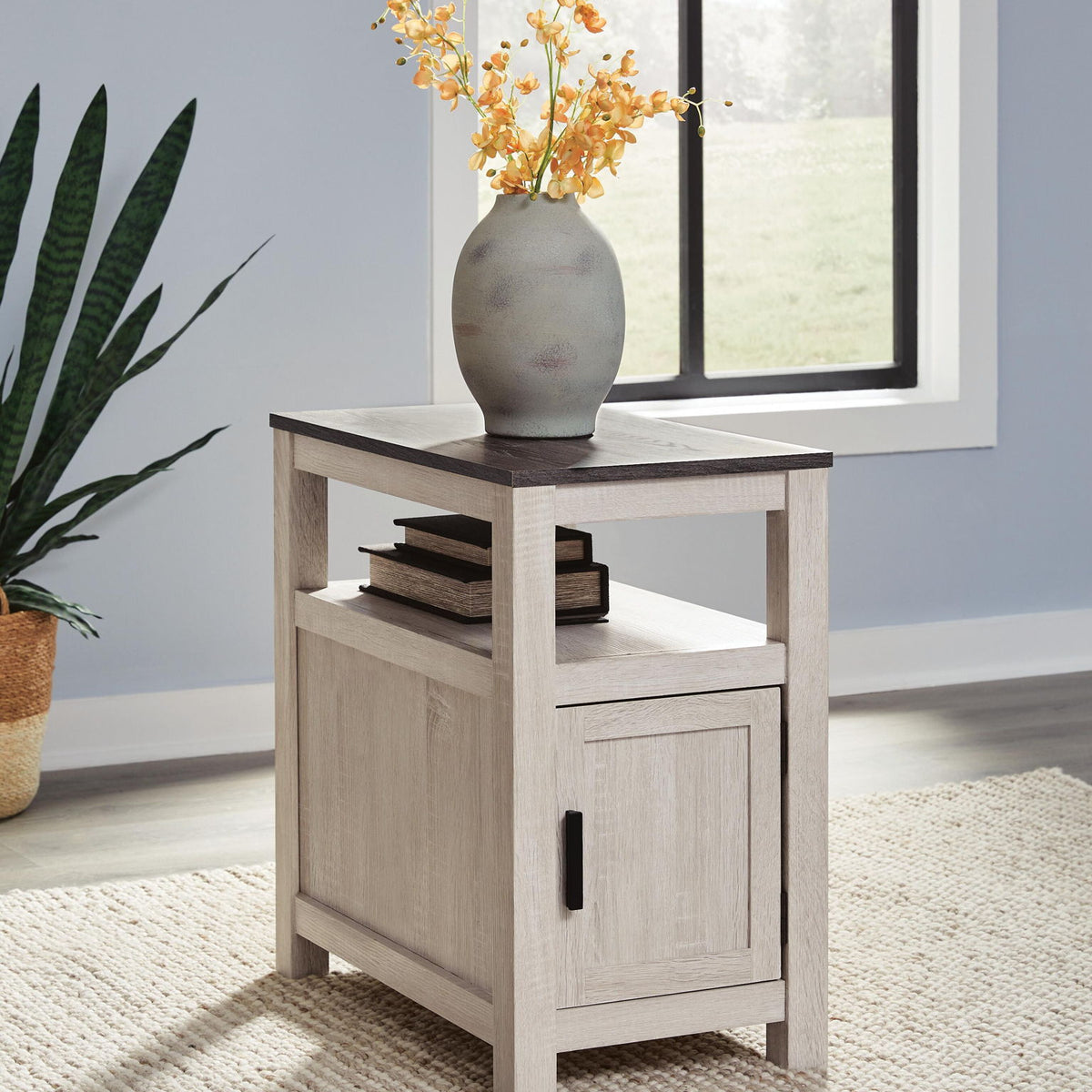 Chair side end table in light gray wood with cabinet door and open shelf