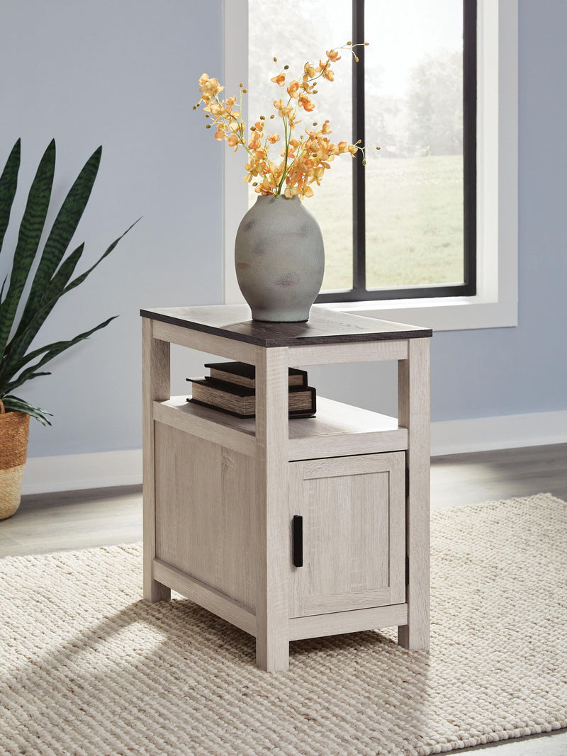 Chair side end table in light gray wood with cabinet door and open shelf