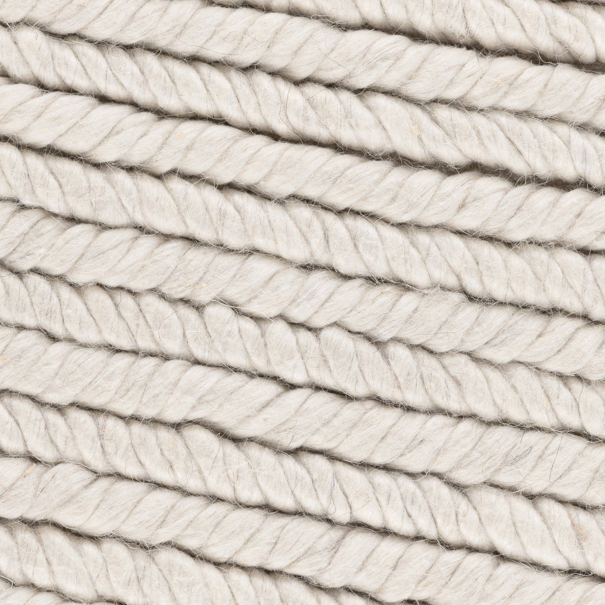 Dawson rug close-up in cream and light gray with braided looped yarn texture