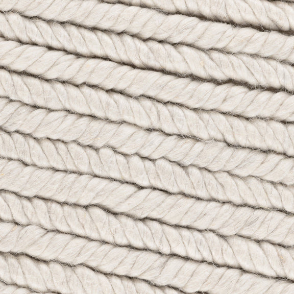 Dawson rug close-up in cream and light gray with braided looped yarn texture