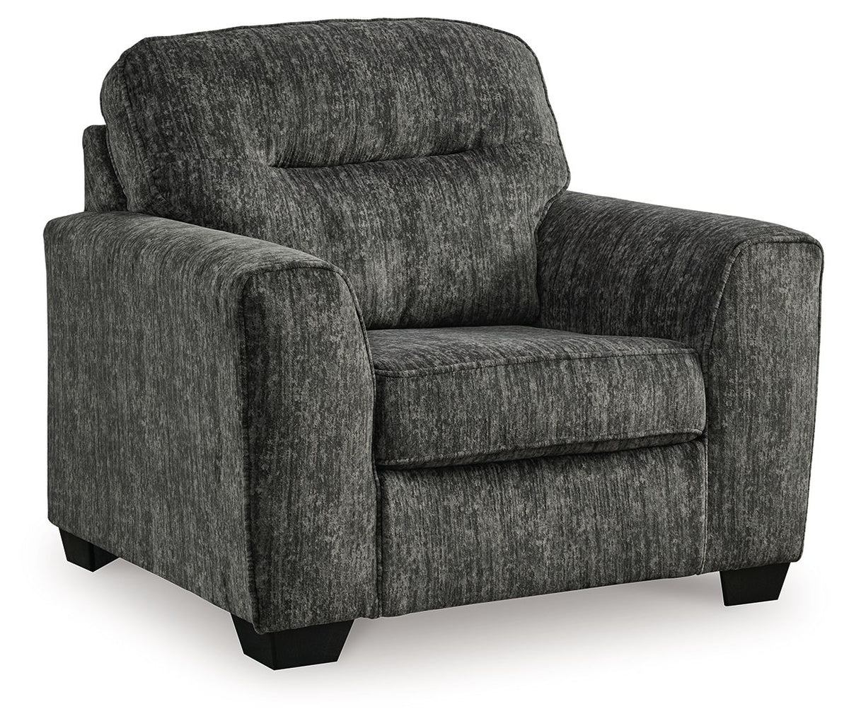 Gunmetal upholstered chair and a half with wide arms, rounded back, and dark legs
