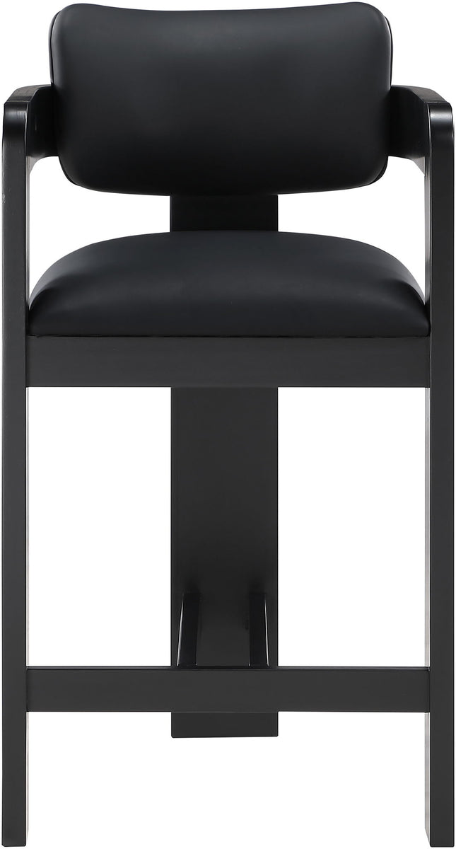 Black vegan leather counter stool close-up with curved backrest and black frame