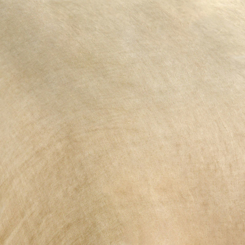 Ochre hemp fabric close-up with visible woven texture and natural flecks