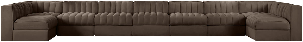 Brown velvet modular sectional sofa with tufted back and curved armrests