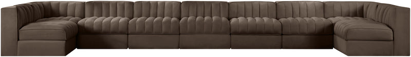 Brown velvet modular sectional sofa with tufted back and curved armrests