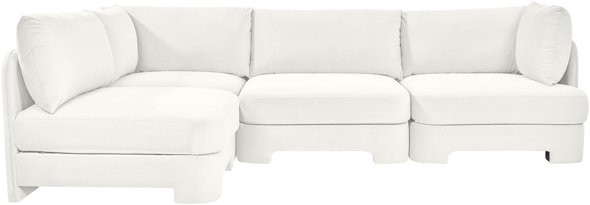 White armless velvet sectional sofa with rounded cushions and back pillows, 4-piece set.