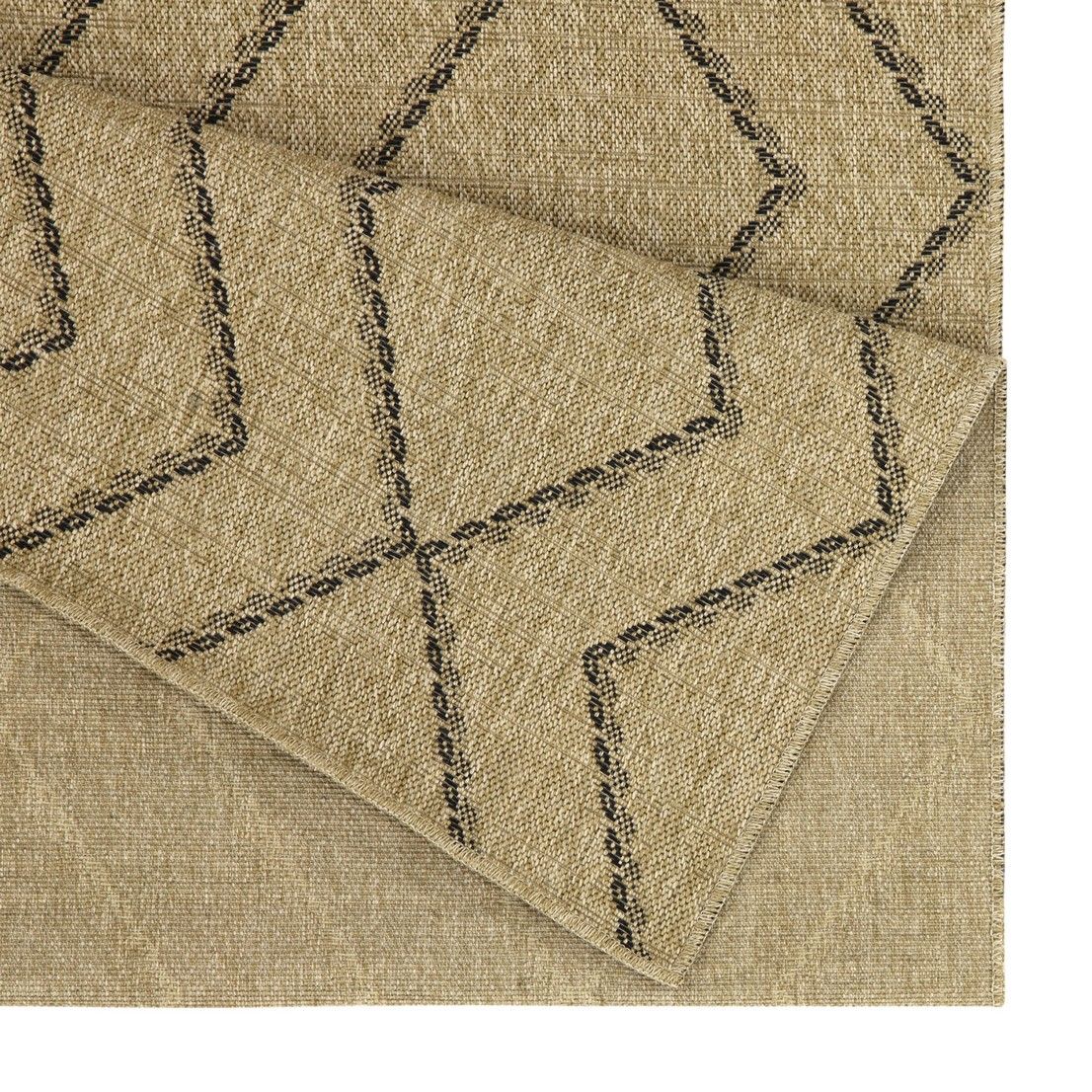 Light brown area rug corner with stitched geometric lines on textured weave