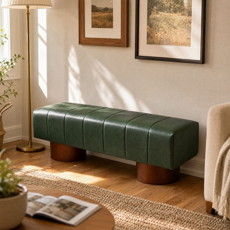 Green upholstered dining bench on short wooden legs in a living room setting