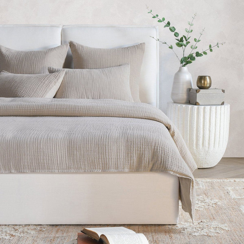 Light gray textured sham pillow with square shape
