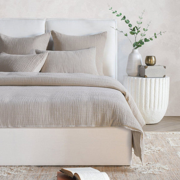 Natural beige textured duvet with matching pillows on a bed