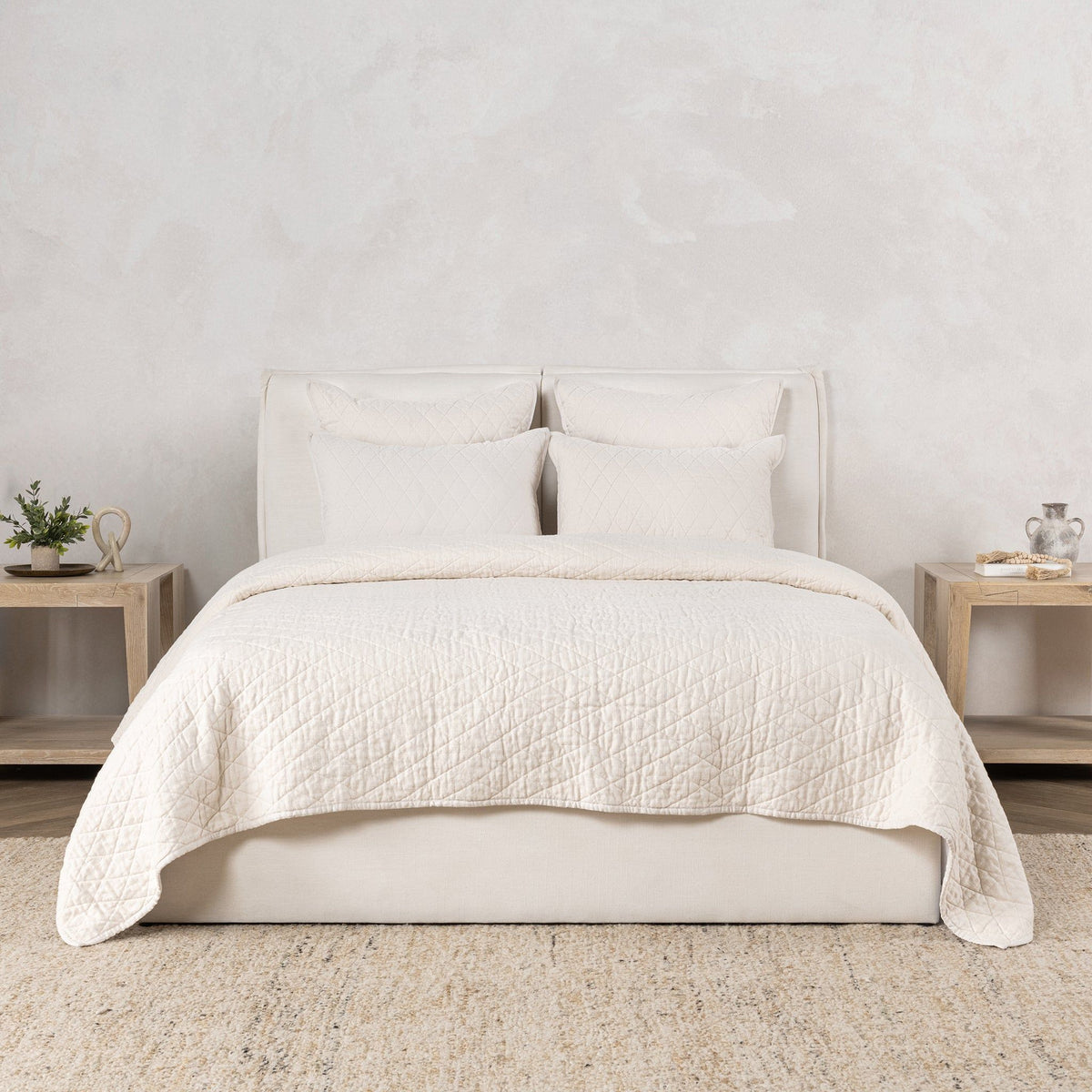 Ivory quilt set with two pillows and quilt cover in bed