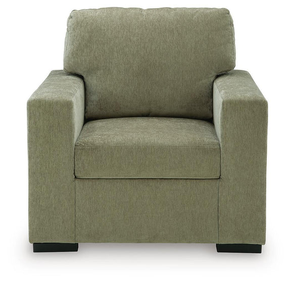 Moss green upholstered accent chair with tall back and wide padded armrests