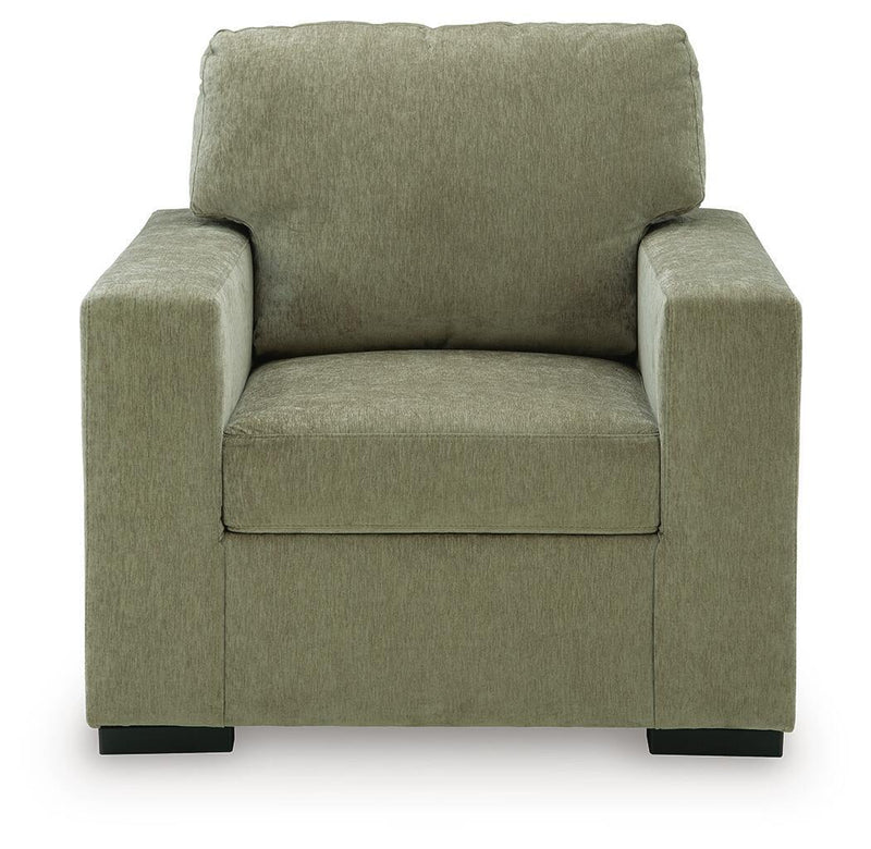 Moss green upholstered accent chair with tall back and wide padded armrests