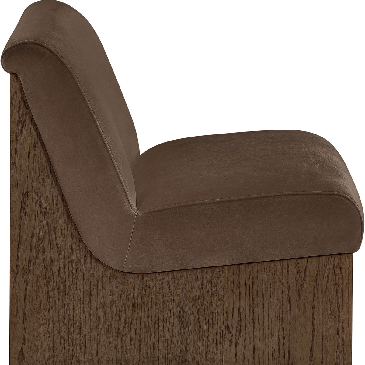 Velvet accent chair with medium brown fabric and curved armrest, walnut-toned wood base.
