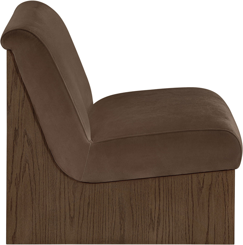 Velvet accent chair with medium brown fabric and curved armrest, walnut-toned wood base.