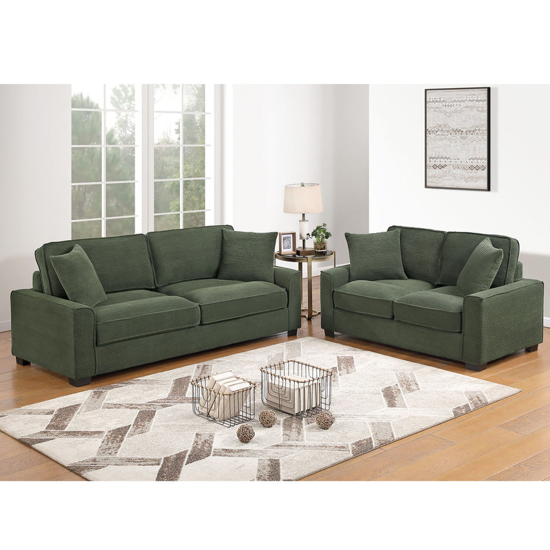 Forest green sofa set with boxy back cushions and matching throw pillows