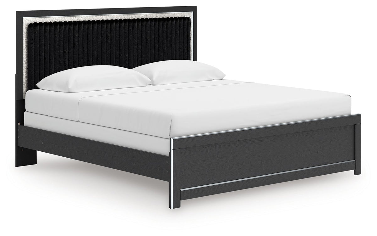 Upholstered panel bed with dark frame, low side rails, and upholstered headboard in black.