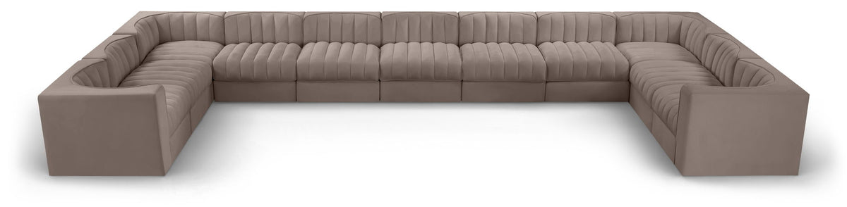 Gray modular sectional sofa with velvet-look upholstery and tufted cushions