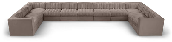 Gray modular sectional sofa with velvet-look upholstery and tufted cushions